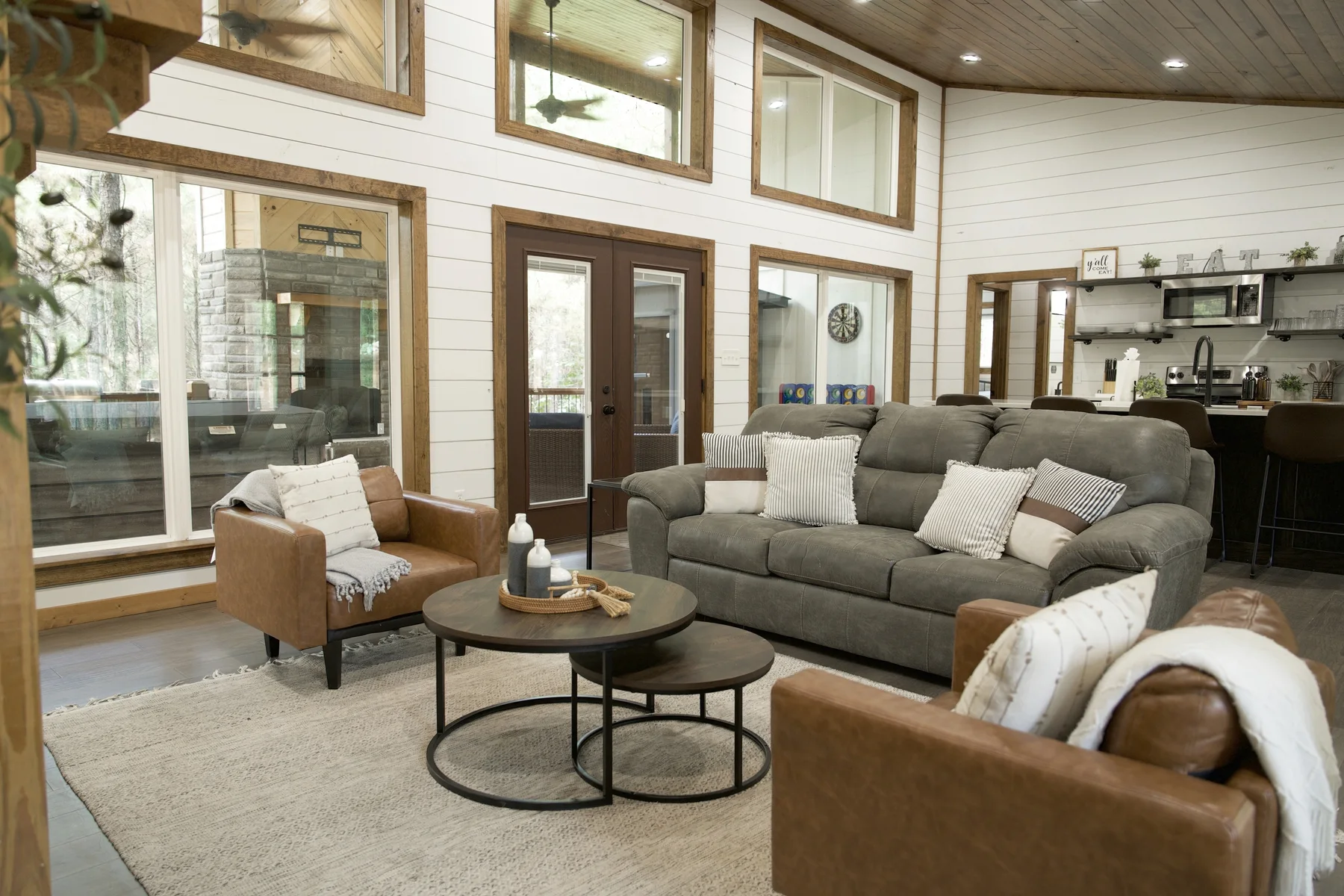 Open cabin living room and kitchen prepared for guests