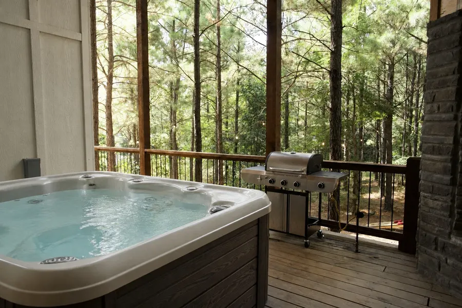 Hot tub on a wooded cabin deck